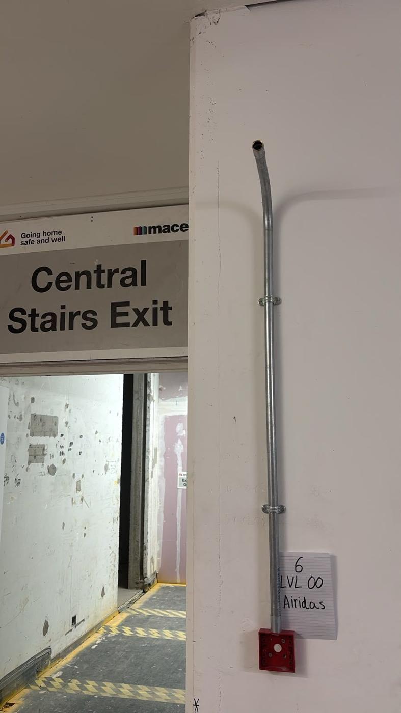 Surface conduit to a call point by the stairs