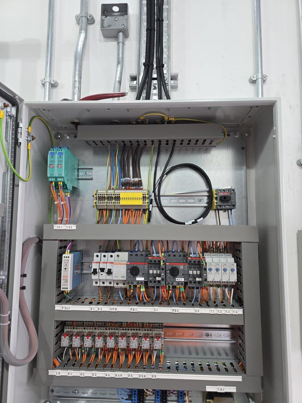 BMS control panel neatly wired with relays, contactors and labelled terminals