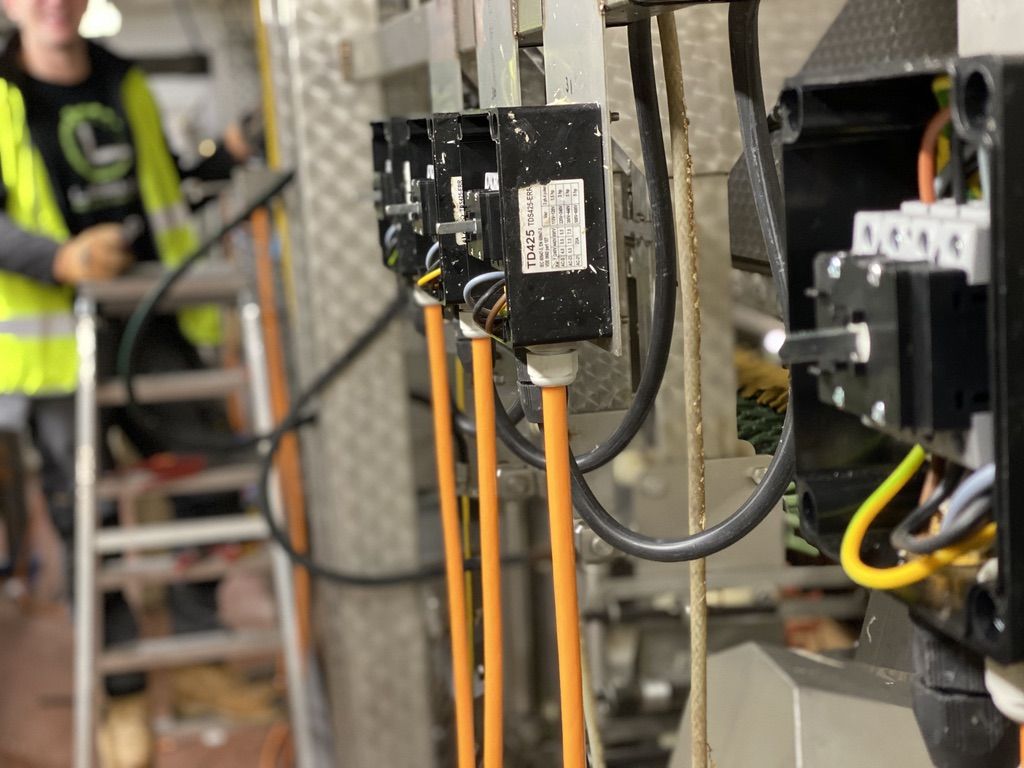 Close view of isolators and orange cables