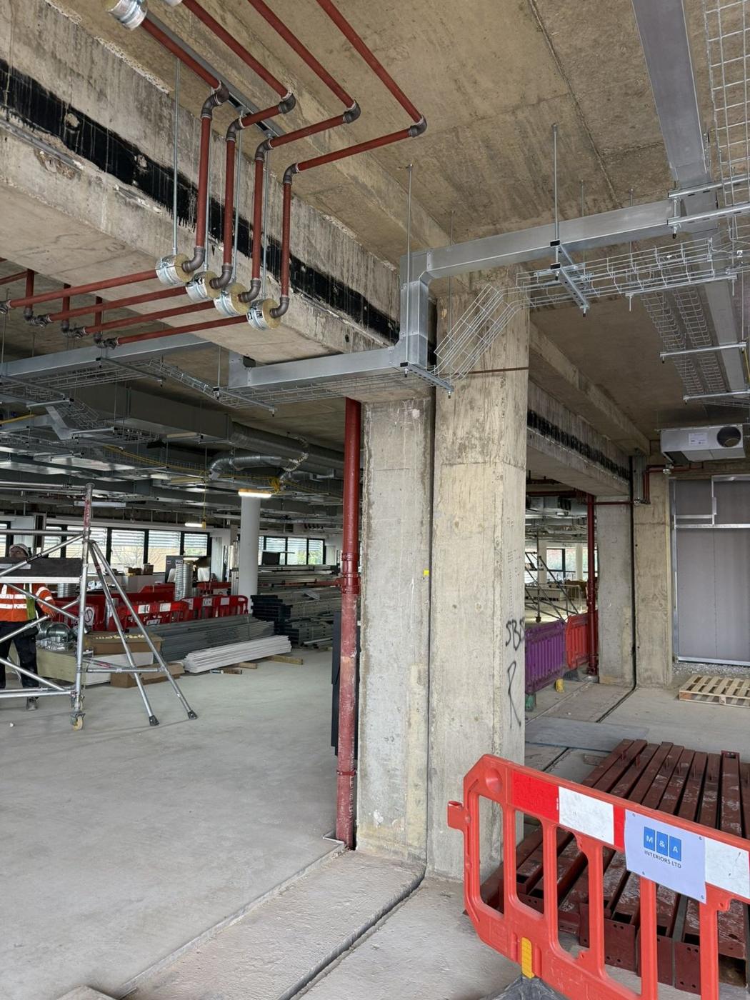 Bright open floor with high-level containment and drop rods in Fulbourn