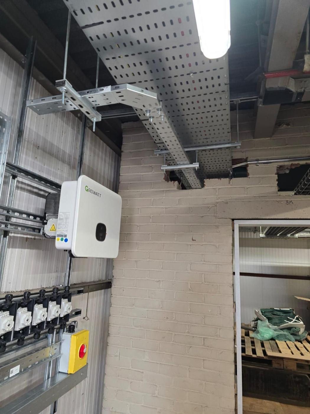Inverter wall with tray and isolators