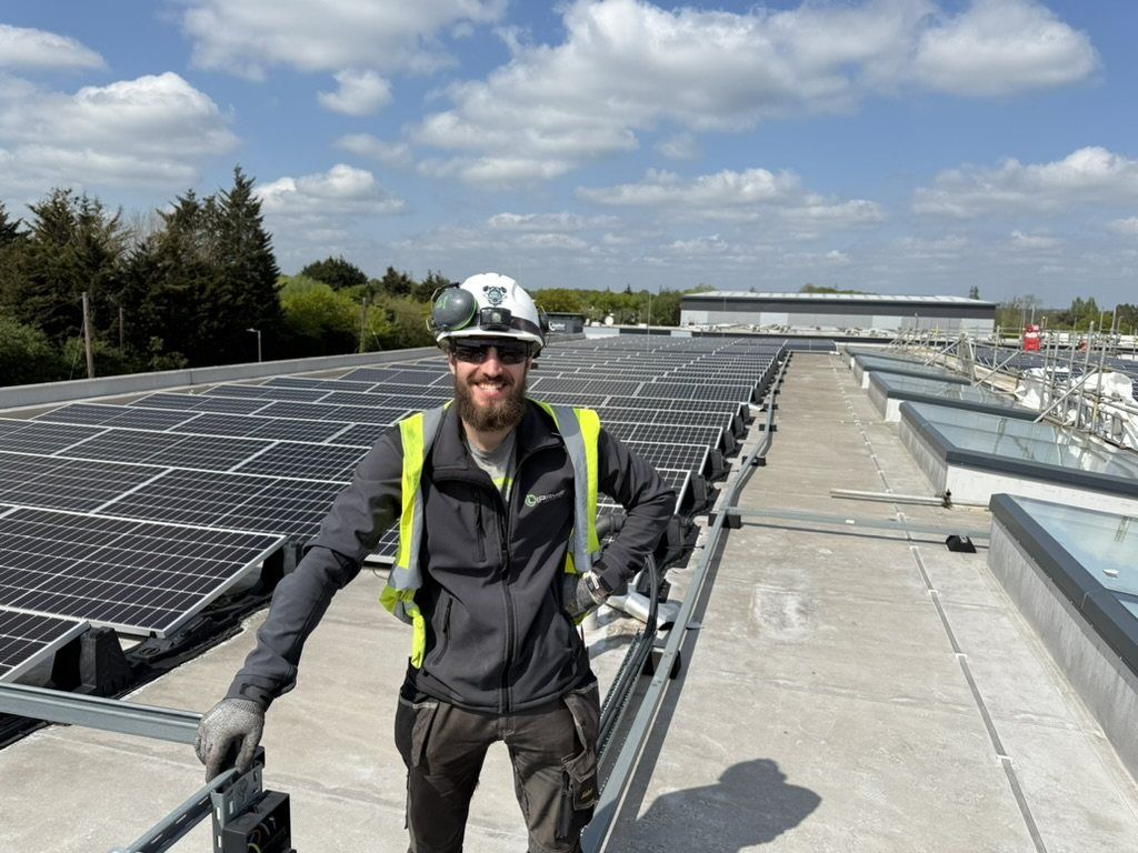 Lipame engineer smiling on a solar roof