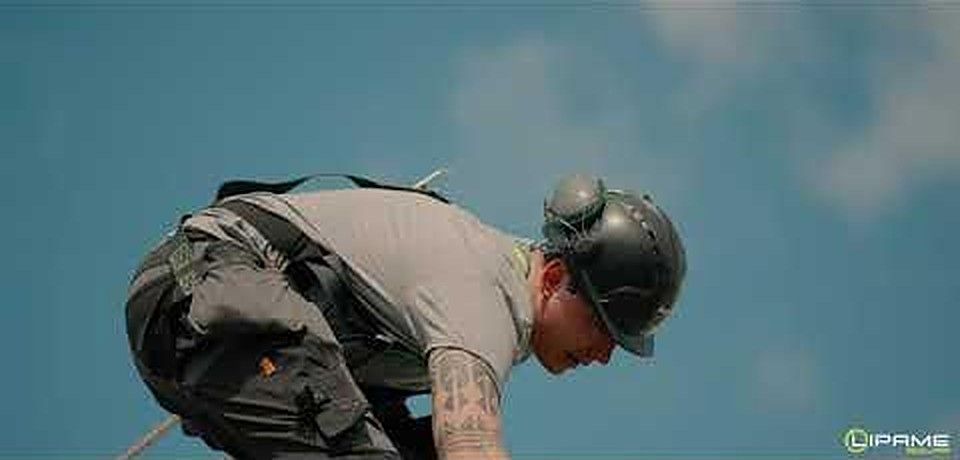 Lipame installer on a roof — still from our solar video
