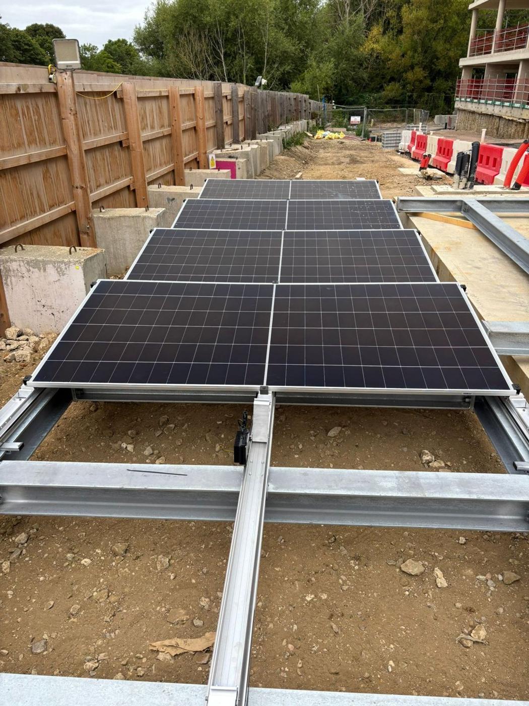Panels laid across frames with the site behind
