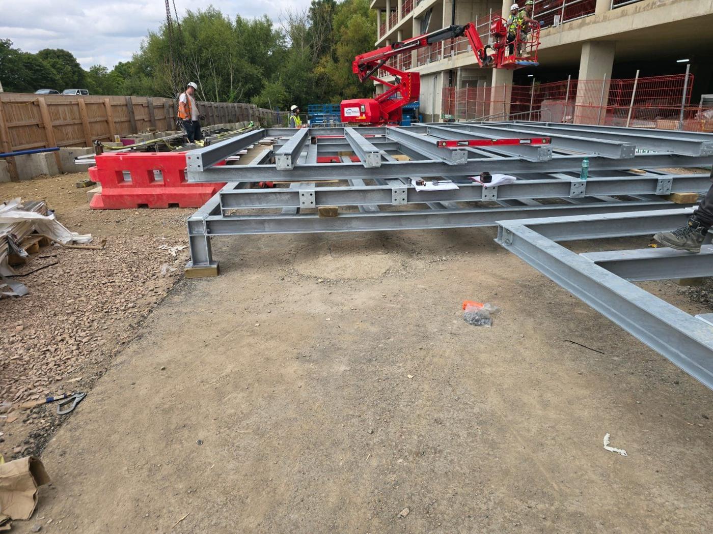 Frames on site with the MEWP at the building