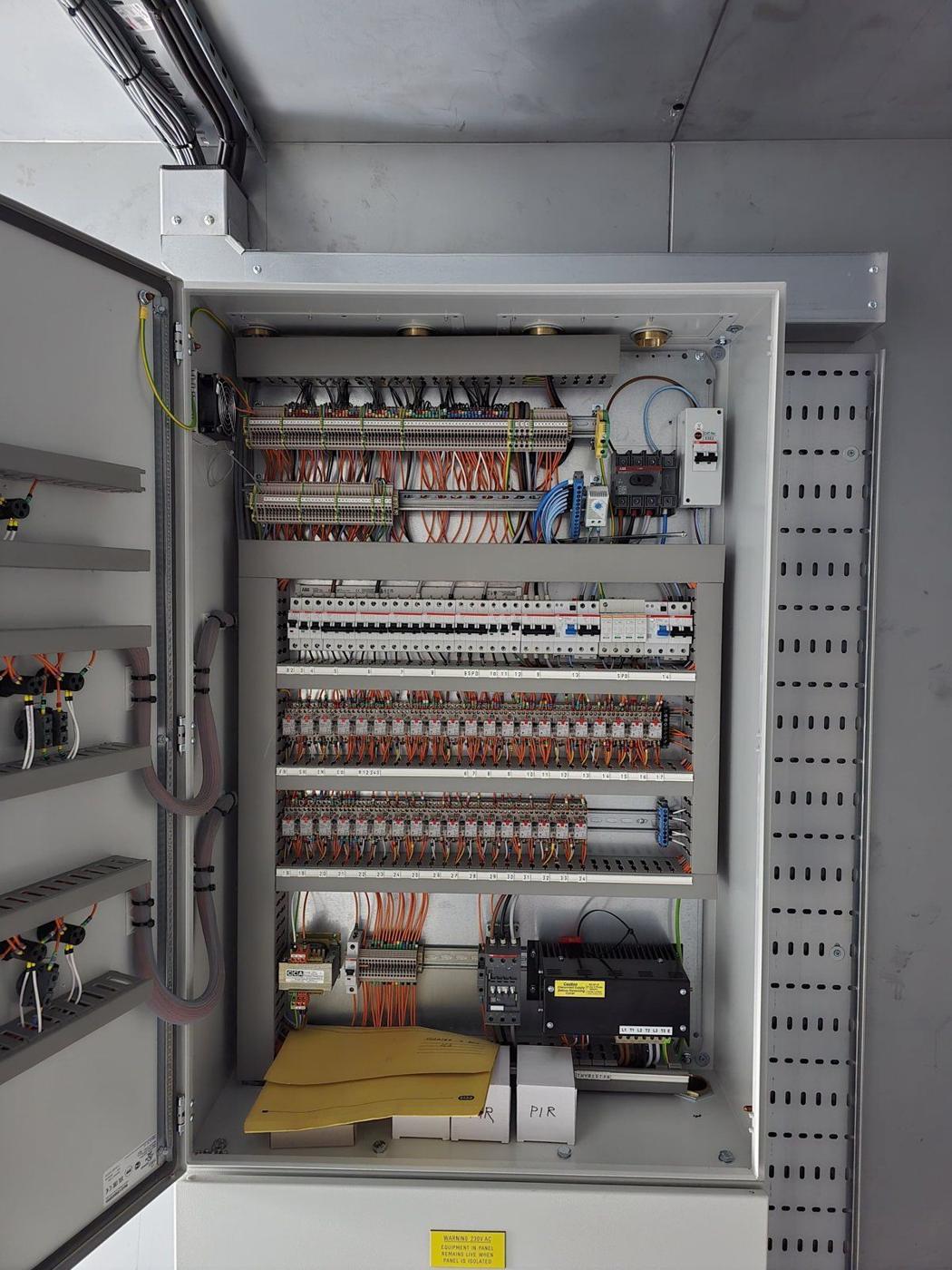 Large floor-standing BMS panel open, fully wired