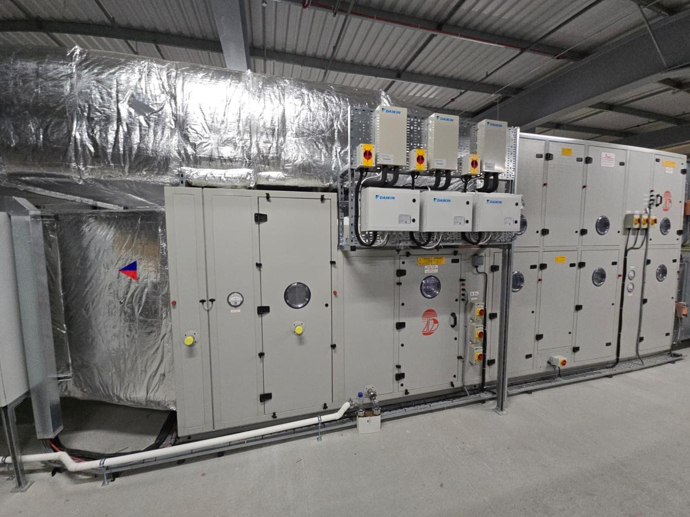 Air handling units in a plant hall with control panels fitted