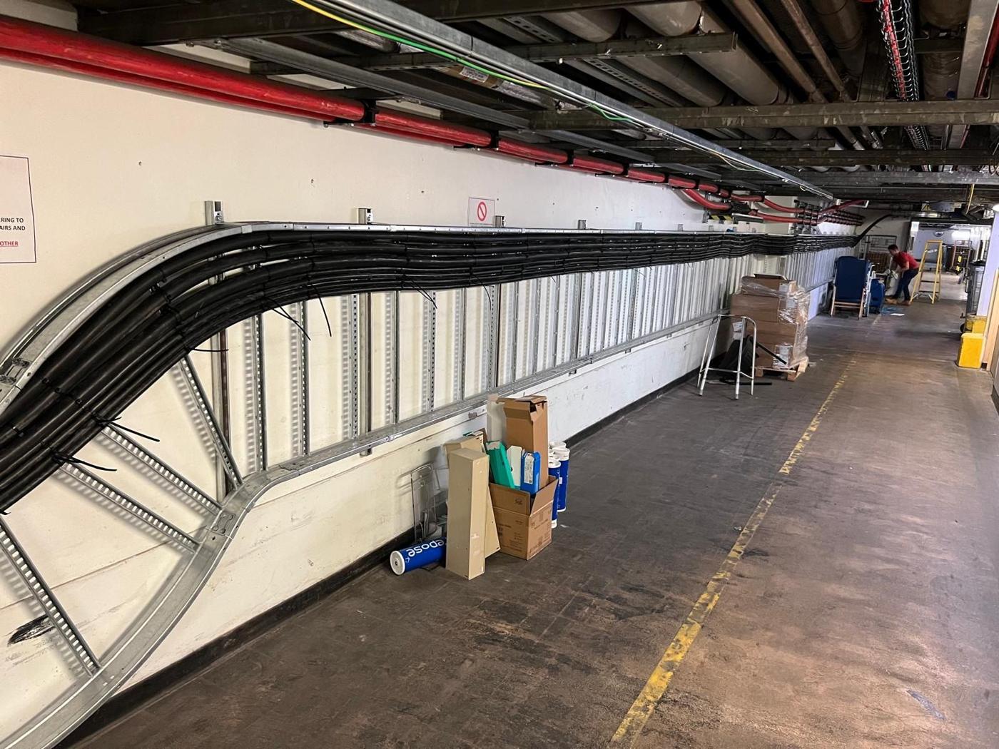 Long run of SWA cables on ladder tray along a corridor