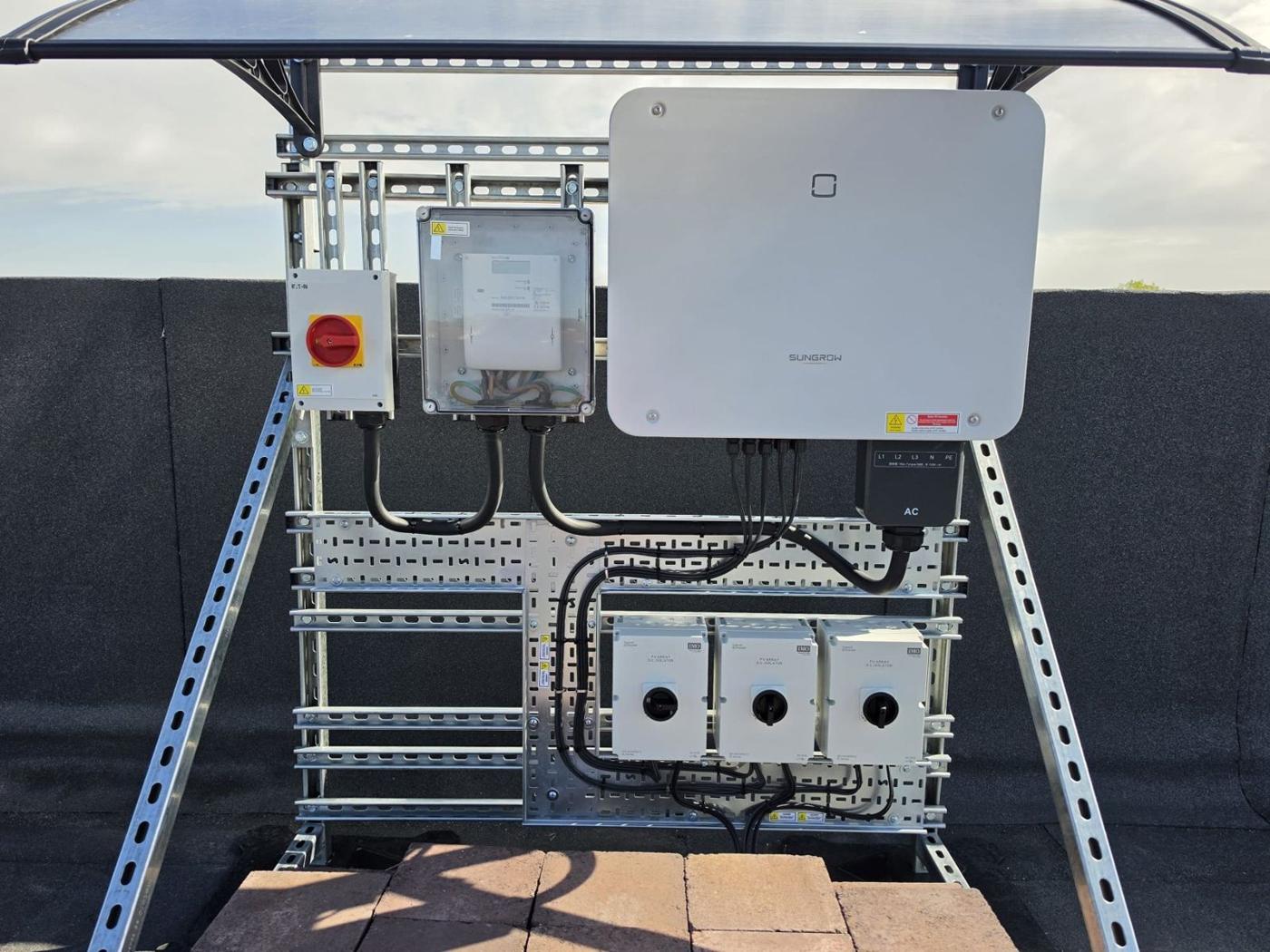Inverter, isolators and canopy on the roof stand