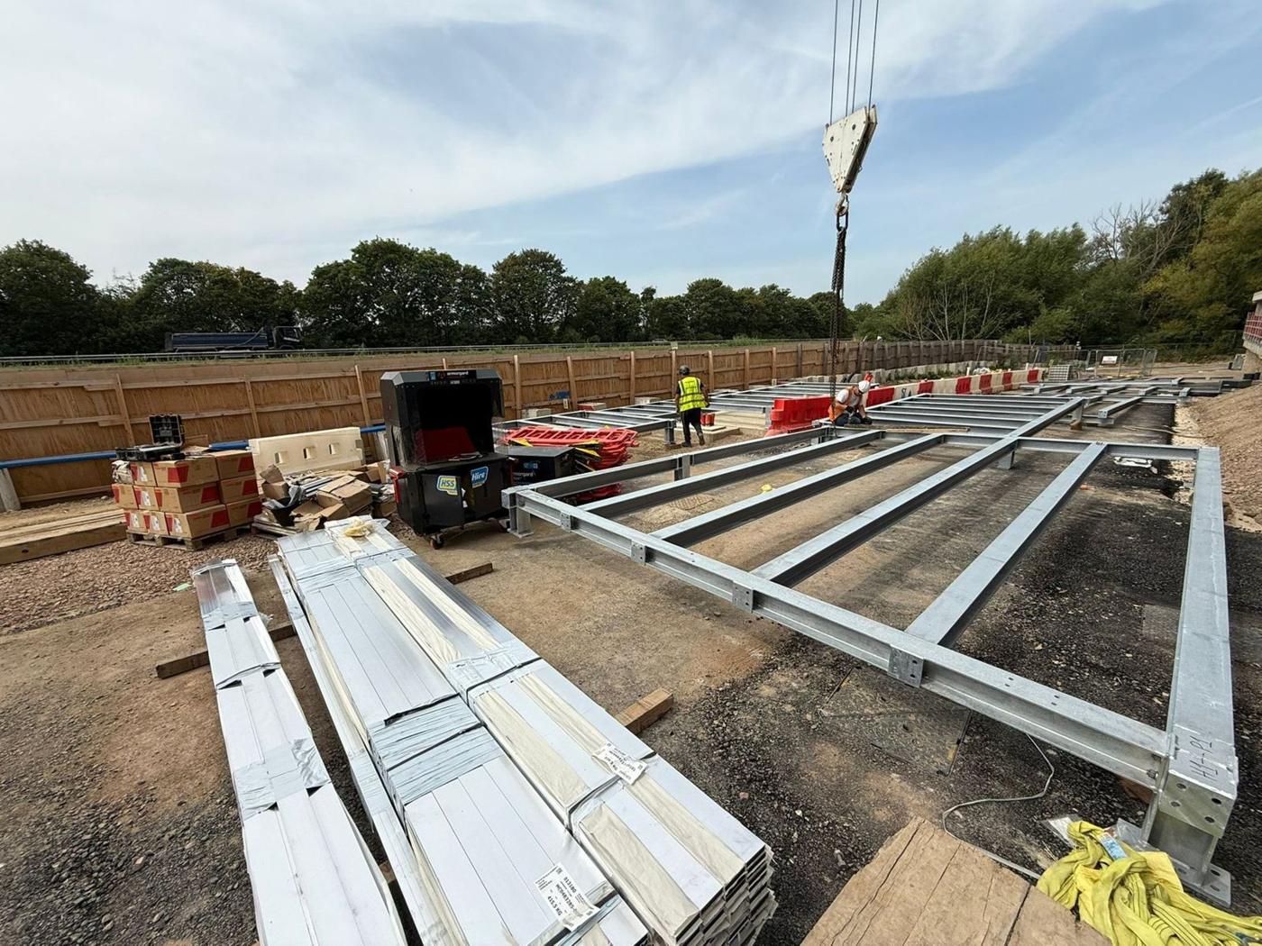 Frames and rails lifted onto the roof by crane at Oxford Science Park