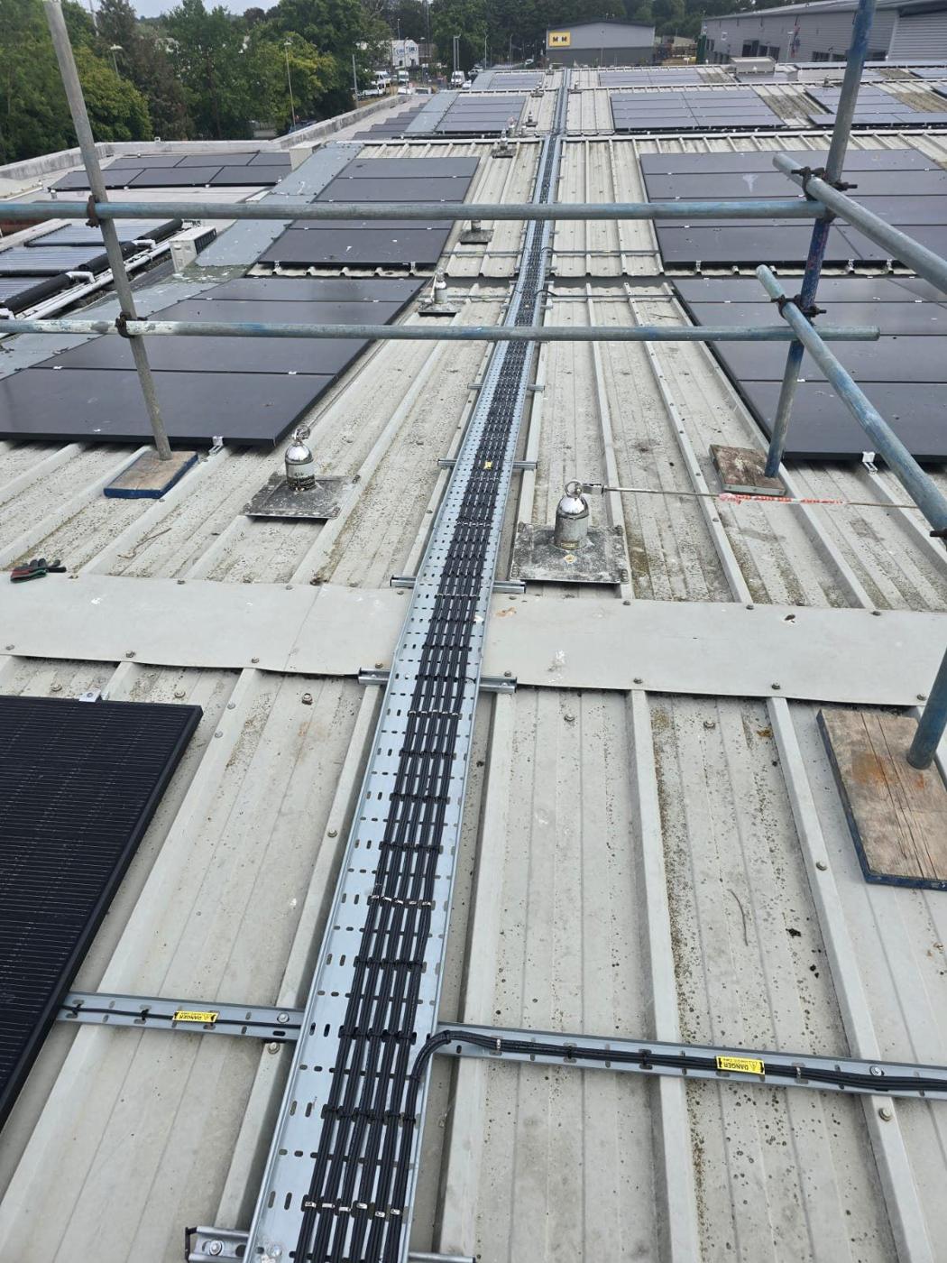 Tray running across the roof between panels