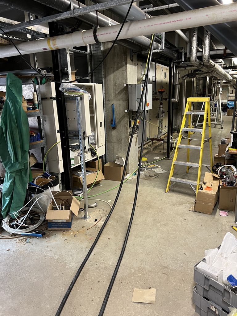 SWA cables laid out across the plant room floor during the pull