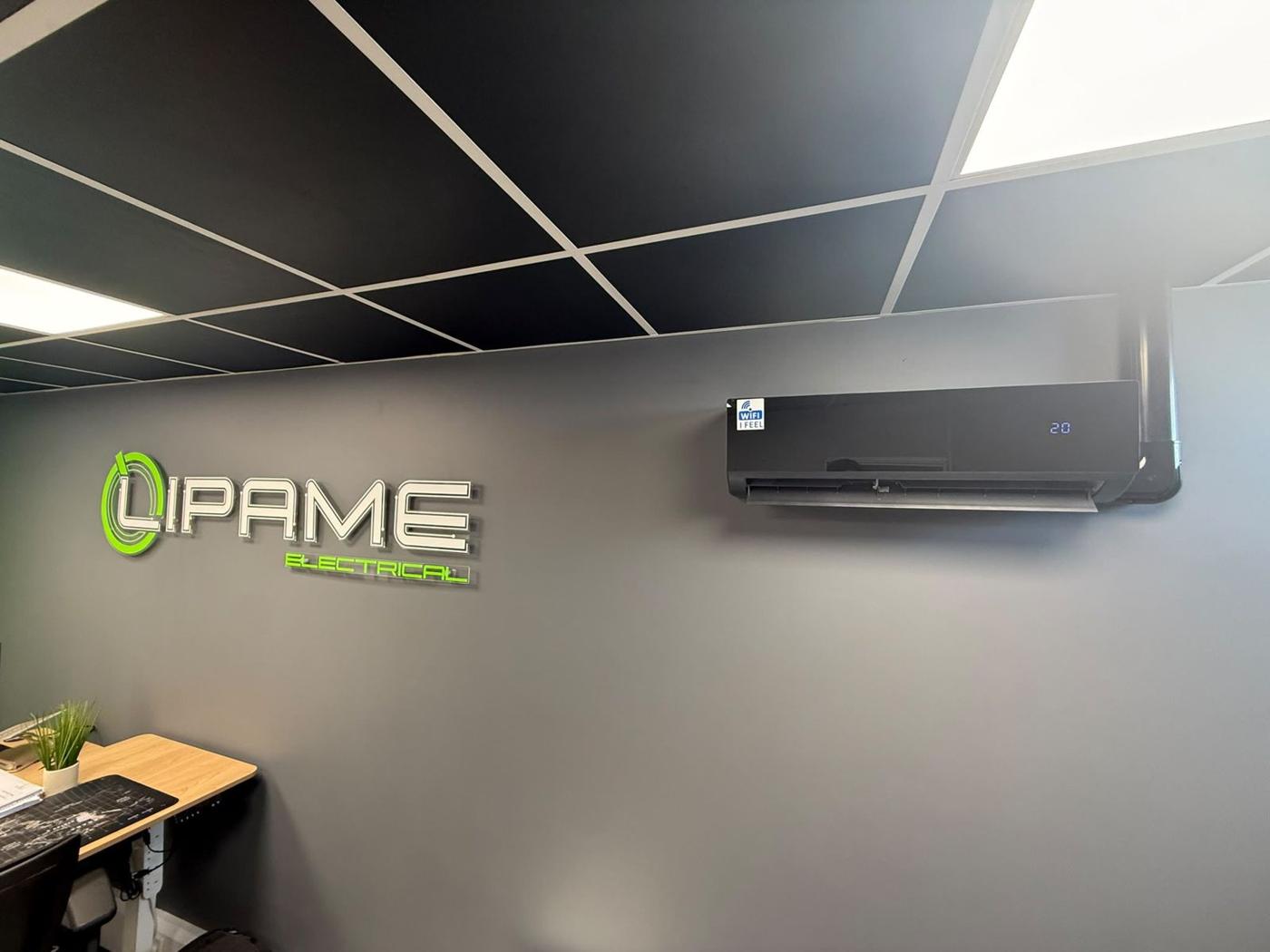 Lipame office: wall-mounted split AC unit installed next to the Lipame sign