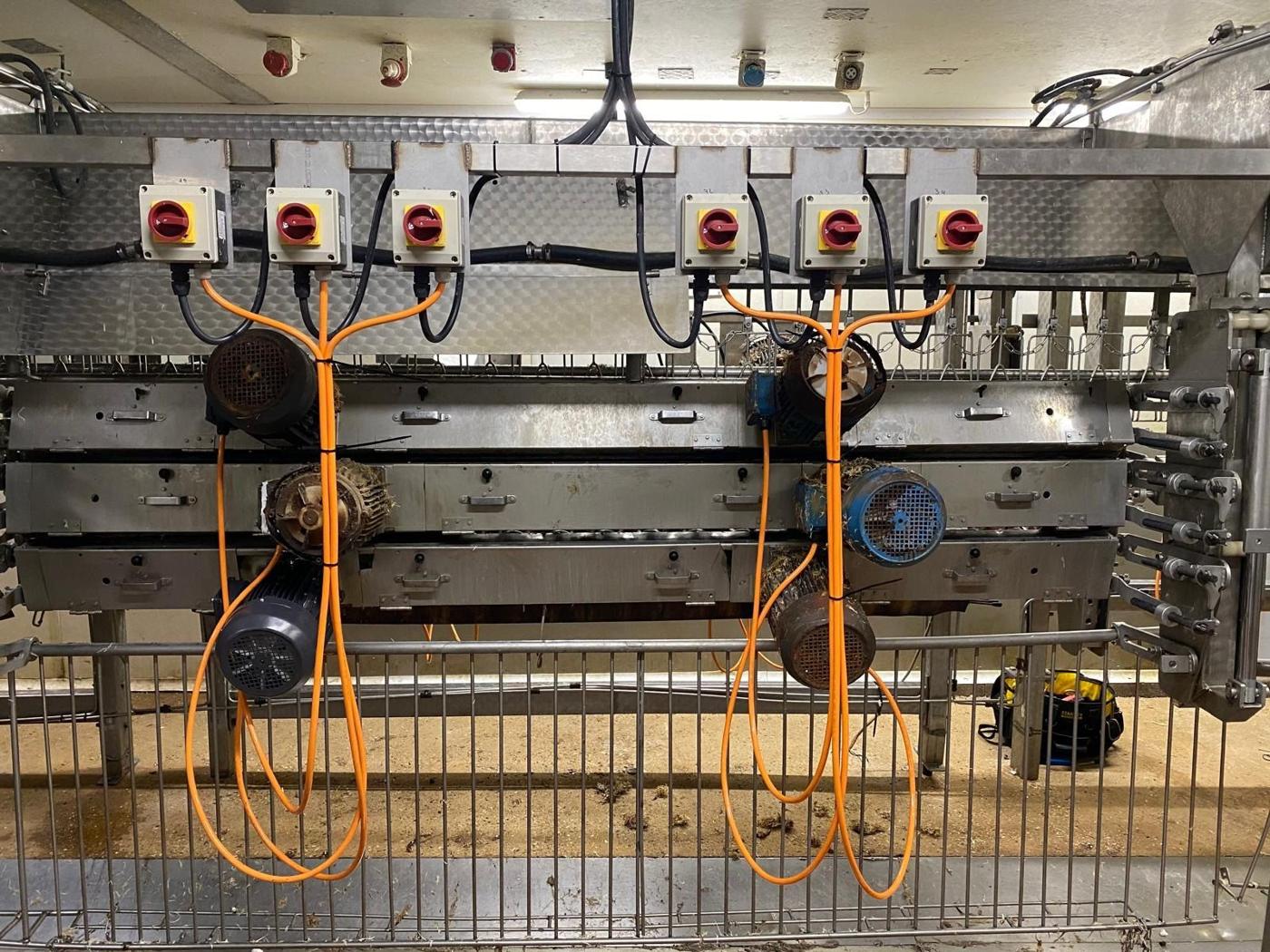Row of isolators with orange motor cables on the line