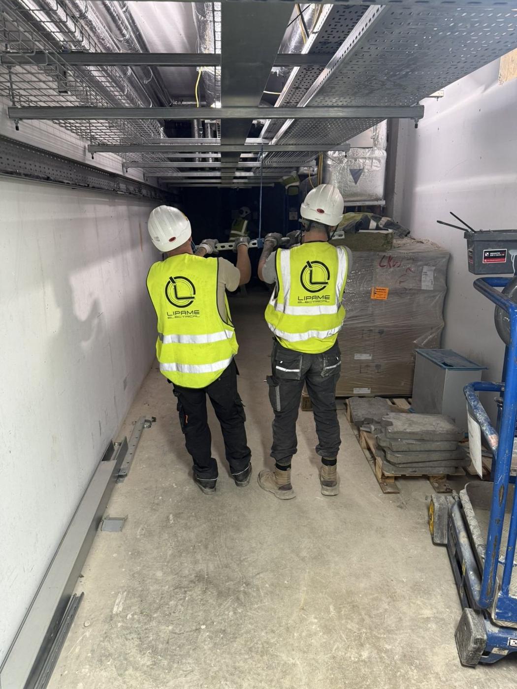 Two Lipame engineers walking a plant corridor