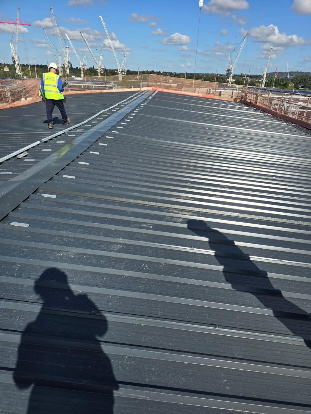 Engineer setting out on a standing-seam roof