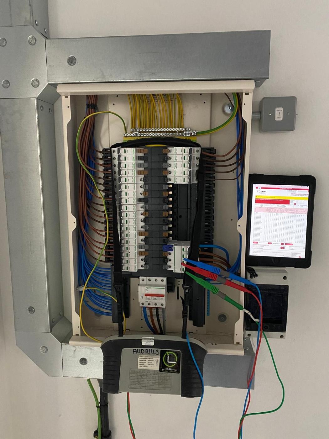 Distribution board with a multifunction tester connected during testing