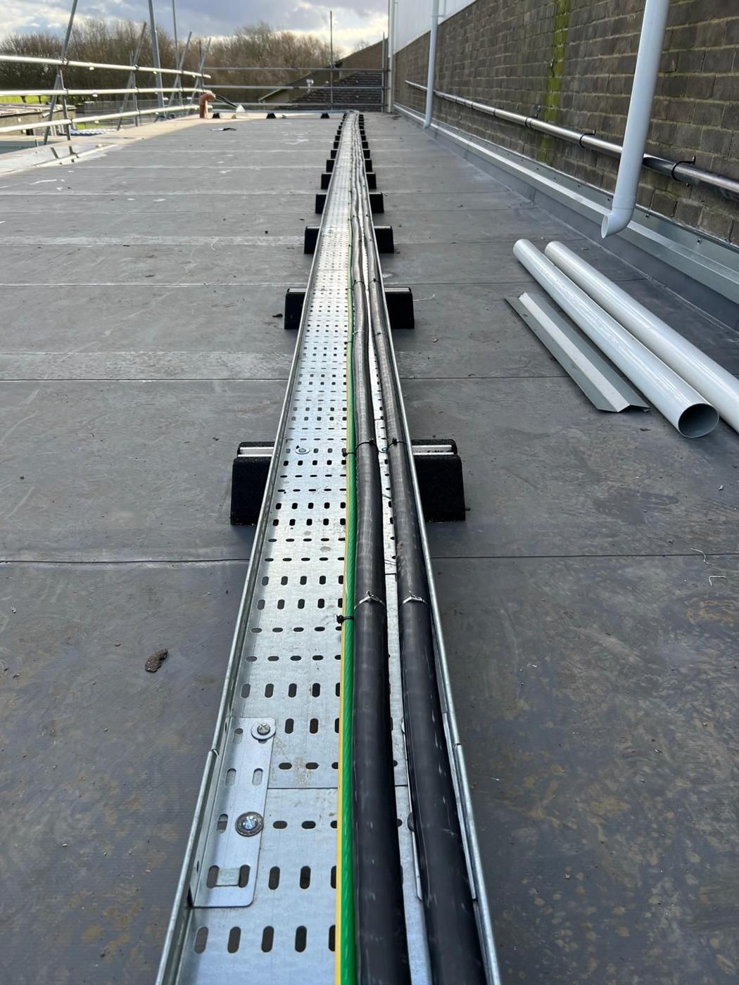 Long cable tray run across a flat roof