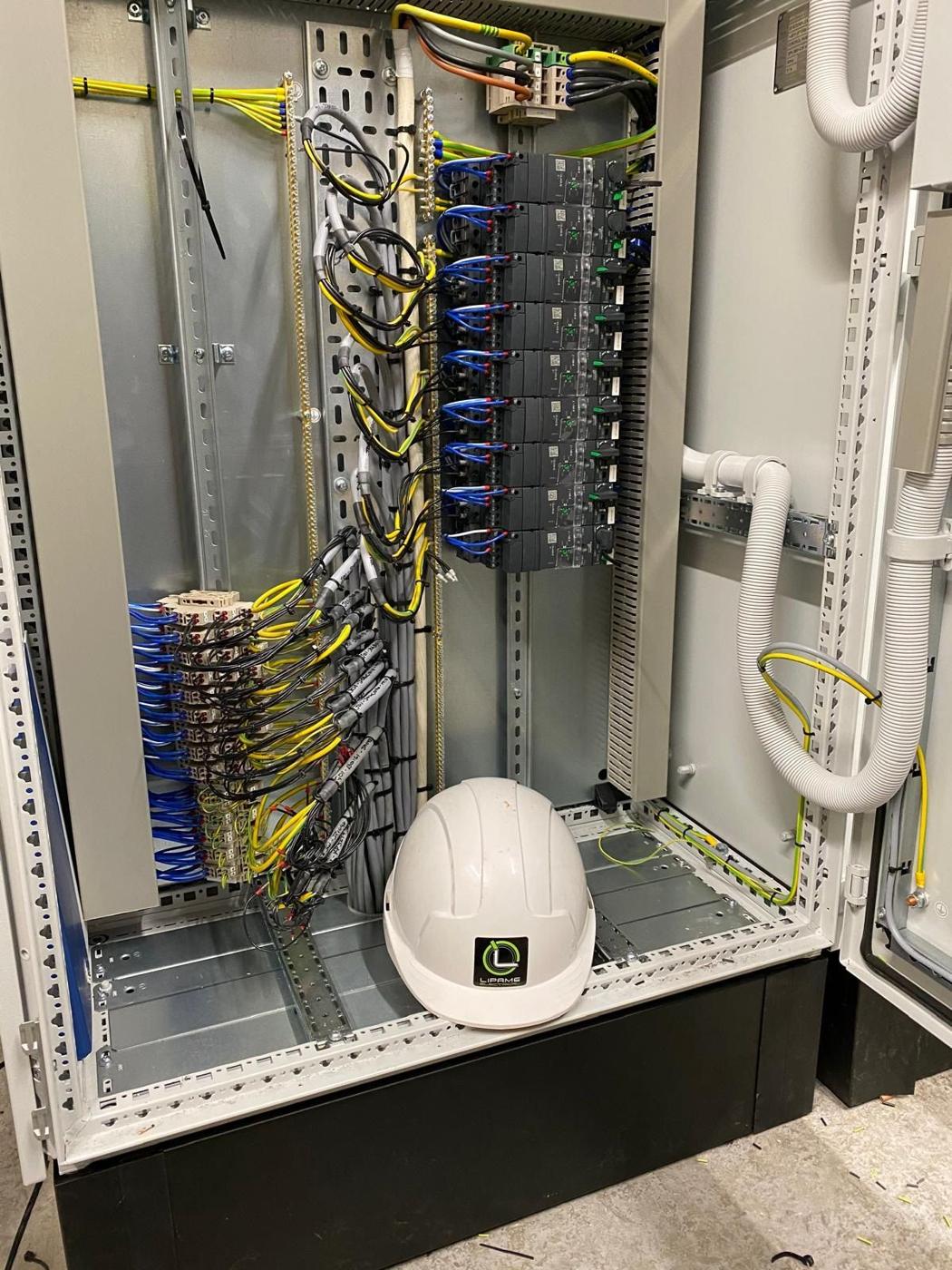 Panel wiring with a Lipame hard hat in the cabinet