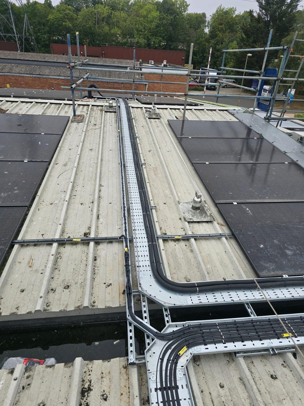 Tray running between solar panels