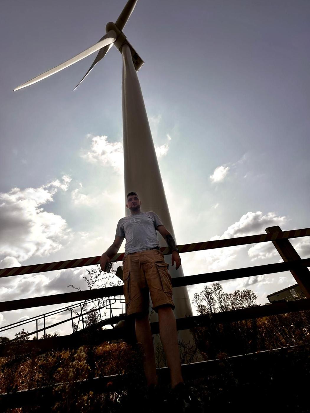 Lipame engineer at the base of a wind turbine