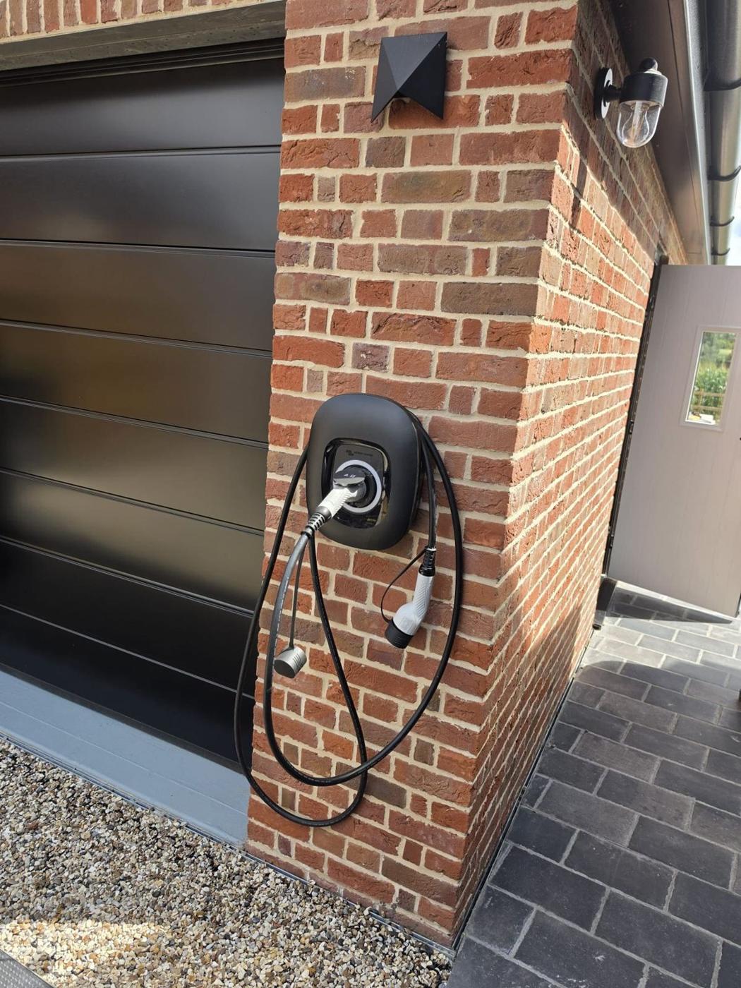 EV charger on a brick wall