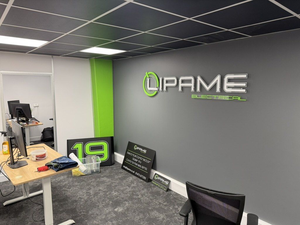 Office with the Lipame logo on a grey wall